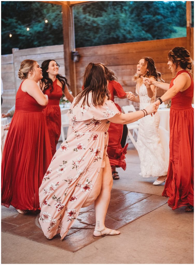 bride and friends dancing together at reception after nashville wedding