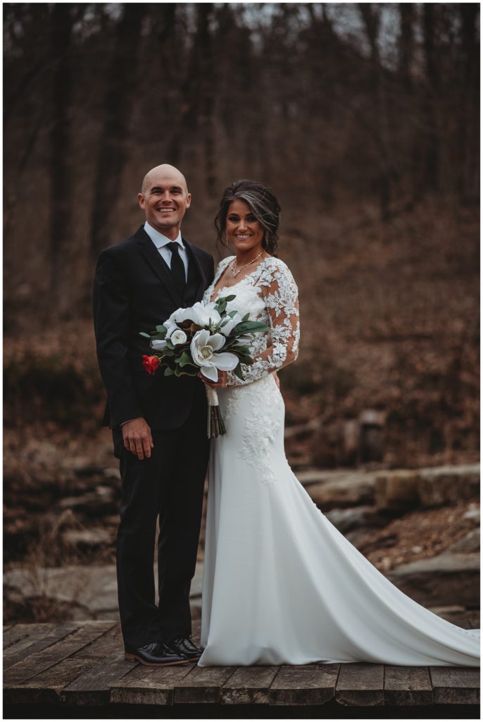 bride and groom smiling together during outdoor bridals