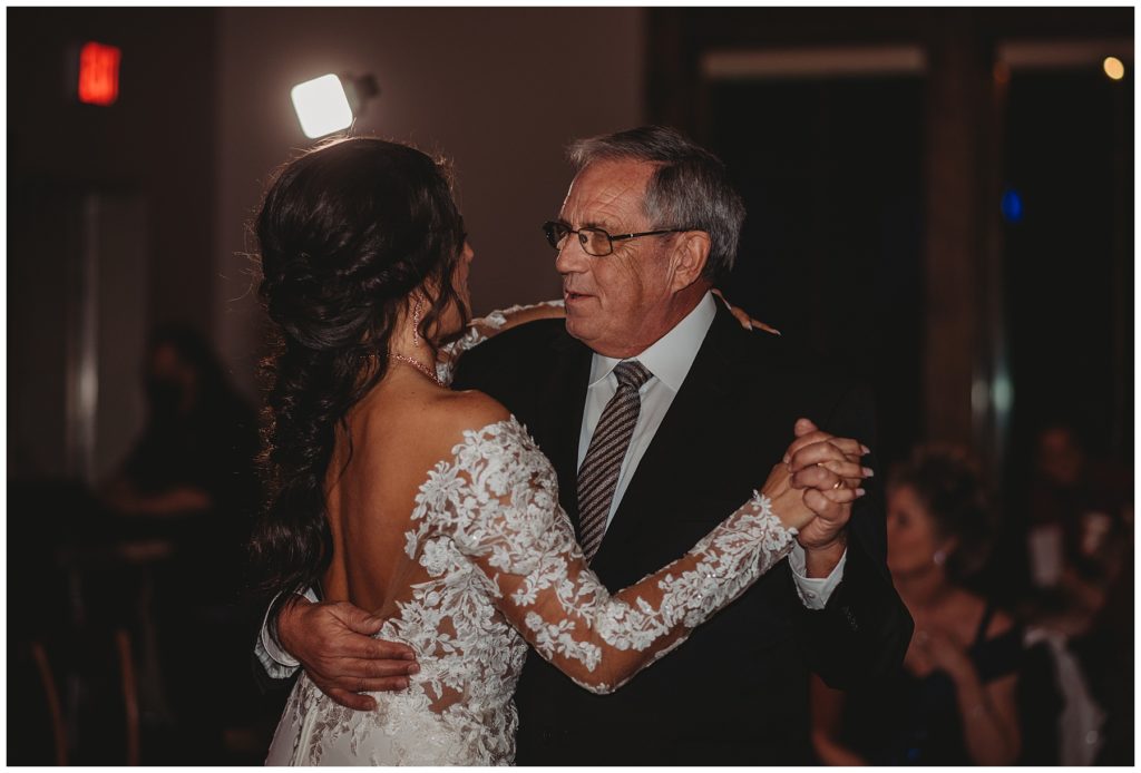bride dancing with father during wedding reception