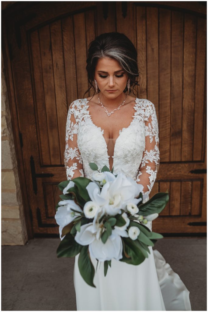 bride staring at bridal bouquet during bridals