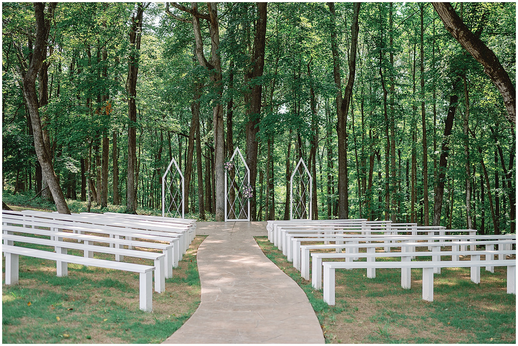 Details of an outdoor hickory meadow charlotte tn wedding reception location with wooden benches in the woods