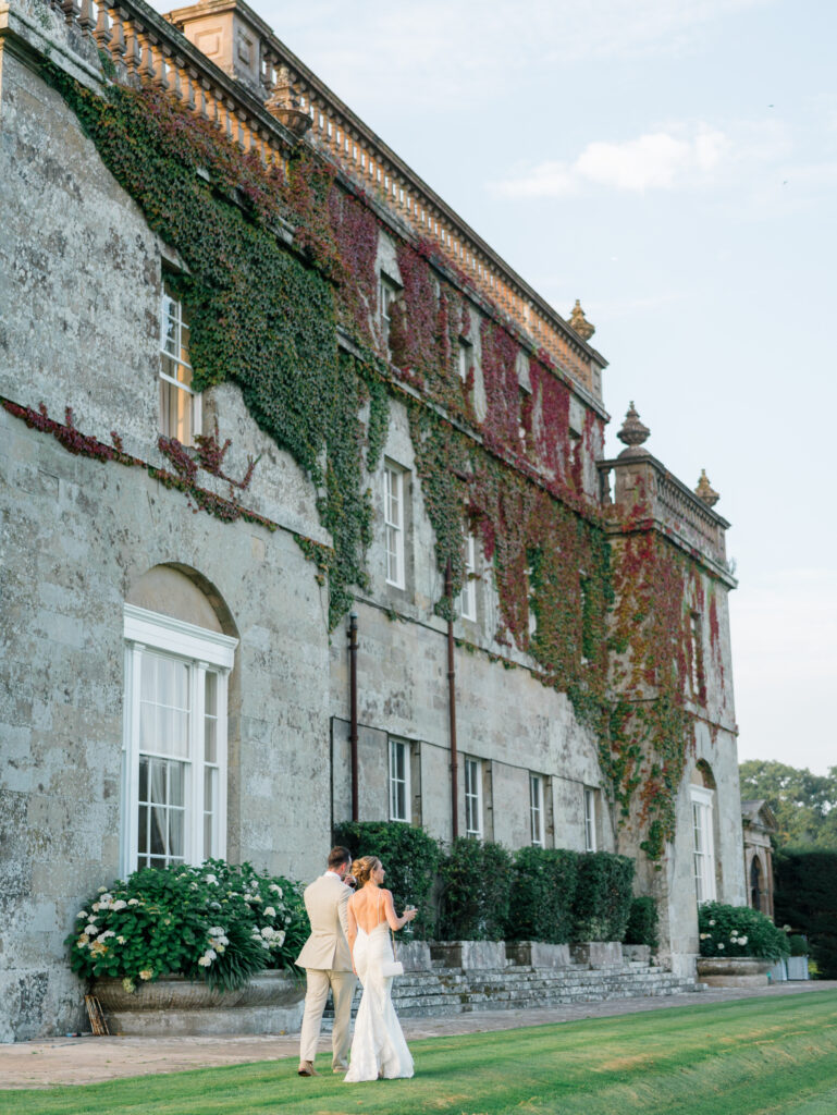 Bride and groom stroll through the grounds at Kinmount House.